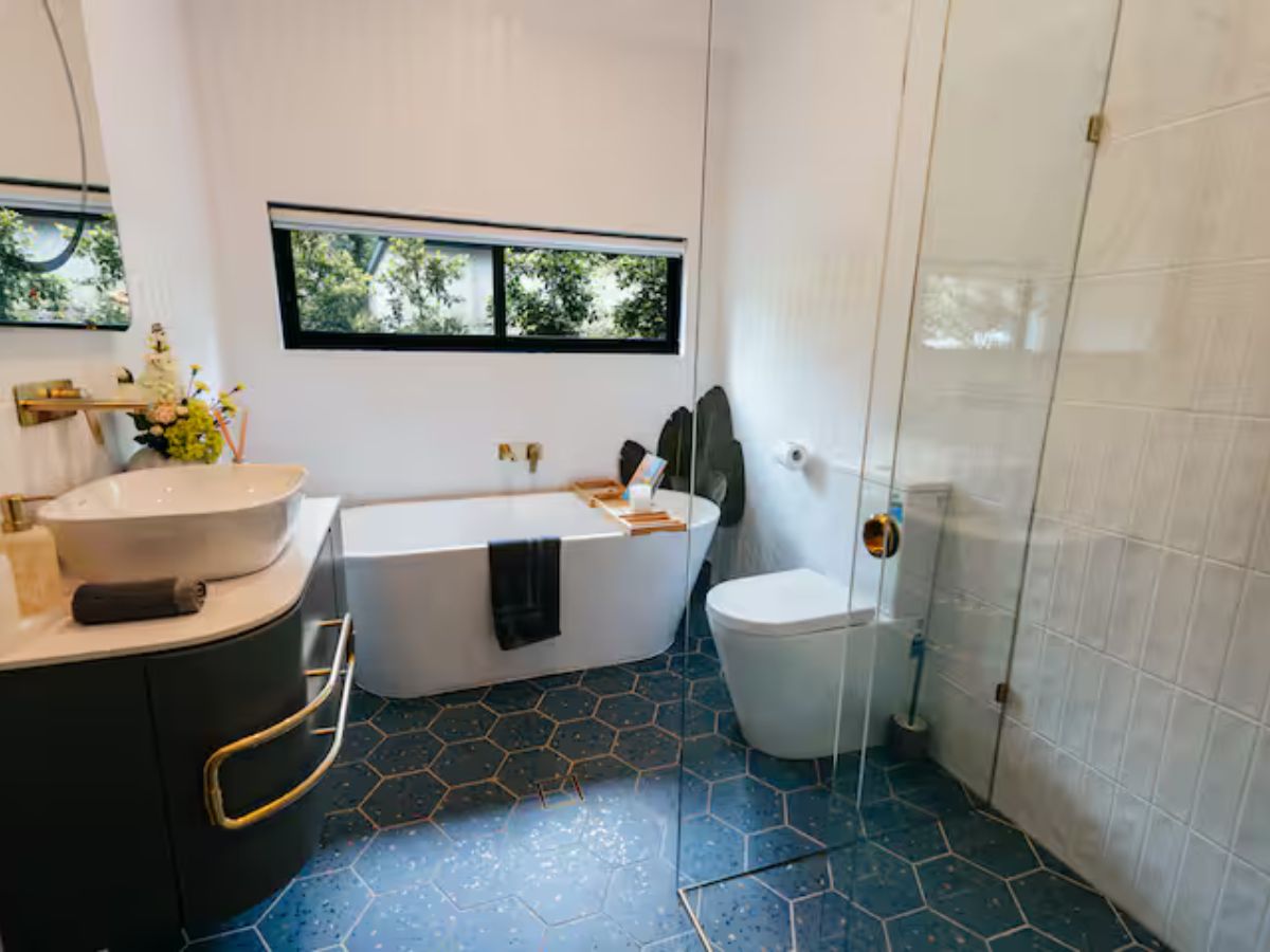 Modern bathroom with premium amenities at Rustic Pine Escape